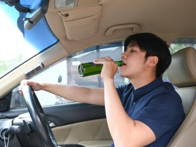 A man drinking while driving