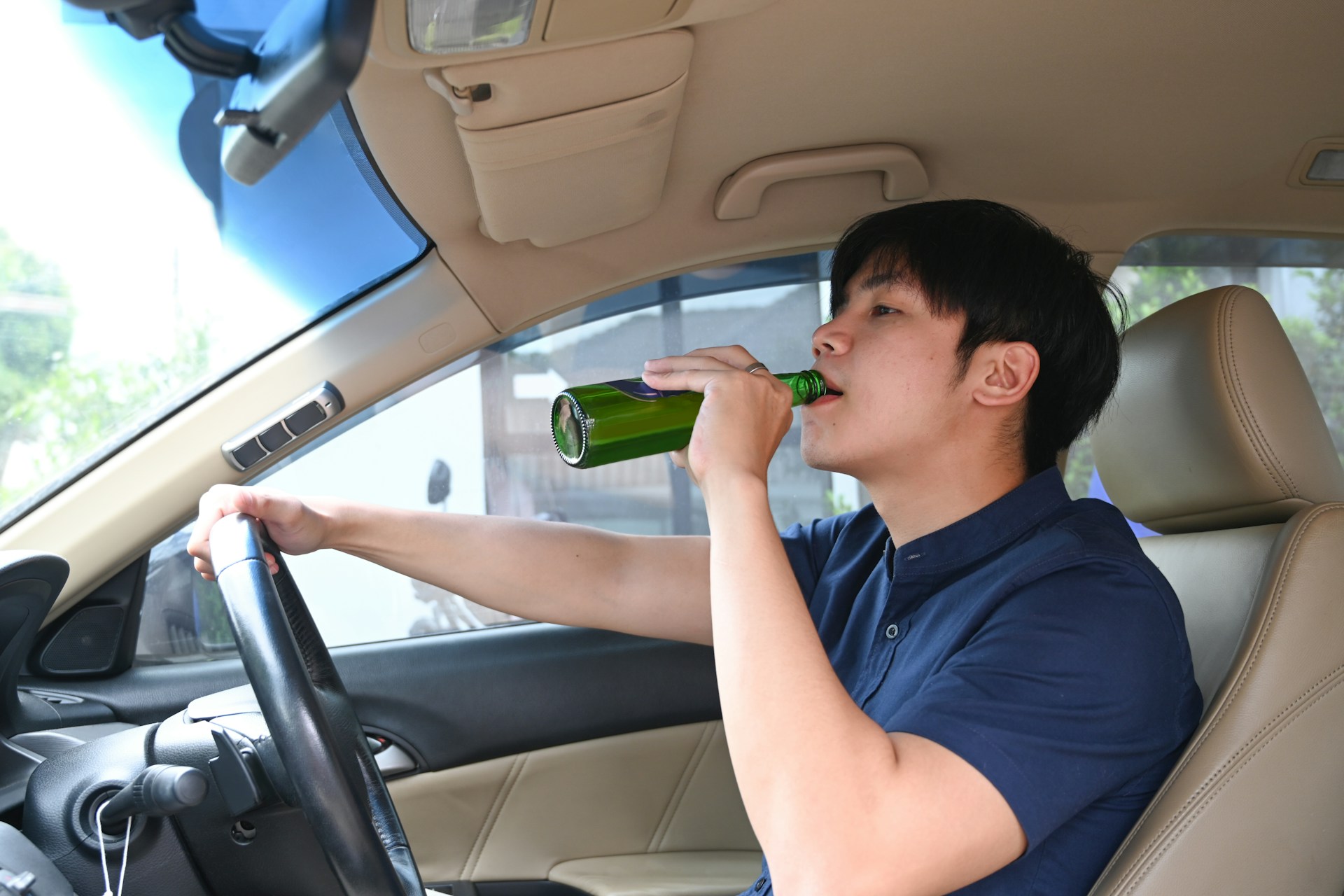 A man drinking while driving