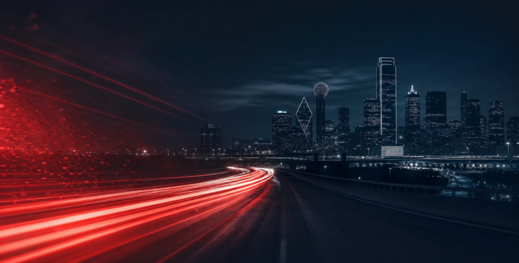 Dallas highway at night with car headlight trails — auto accident attorney near me in Frisco TX